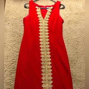 Red embroidered patterned dress.